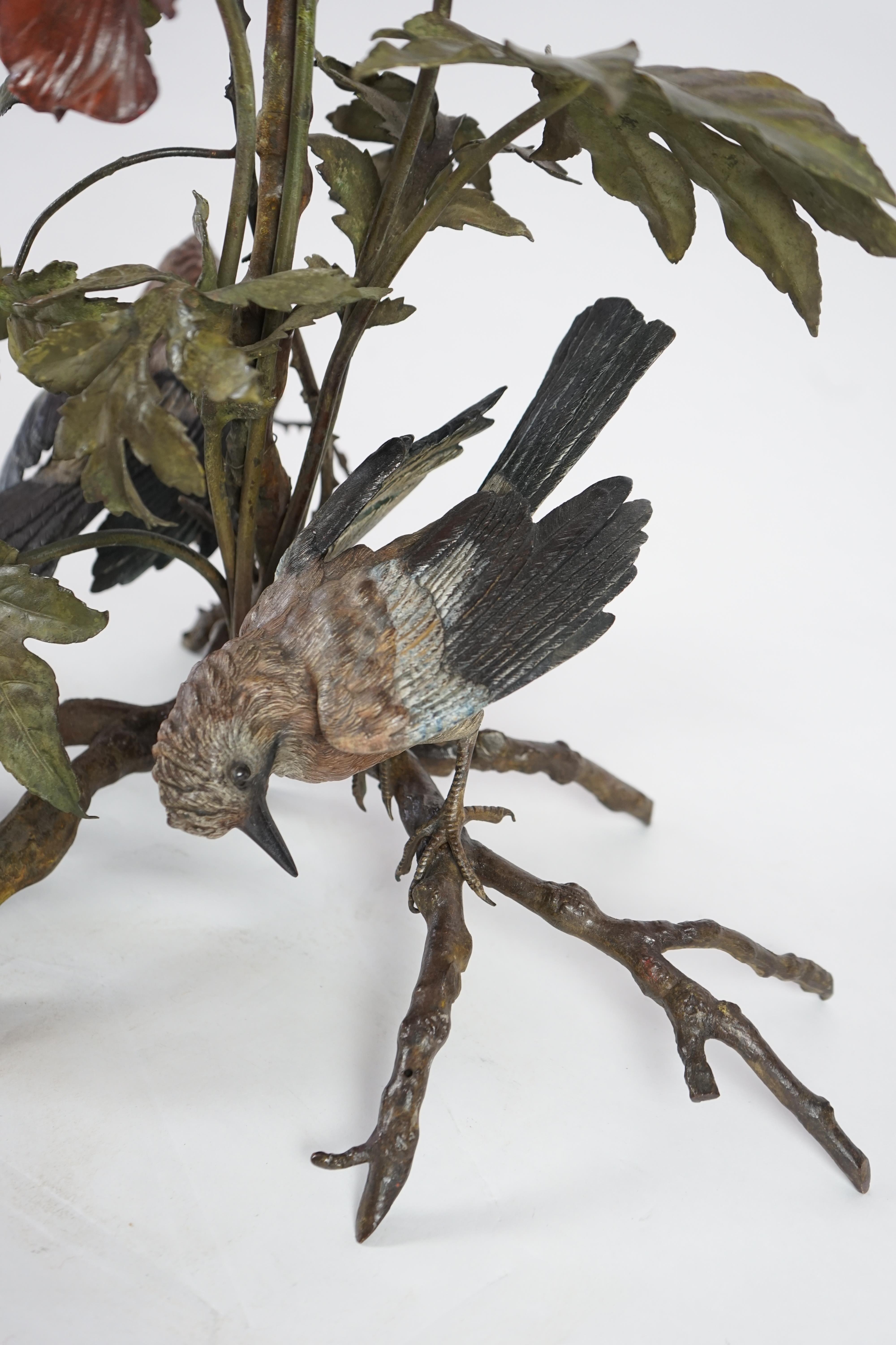 An impressive late 19th century Austrian cold painted bronze group of three jays perched amongst branches